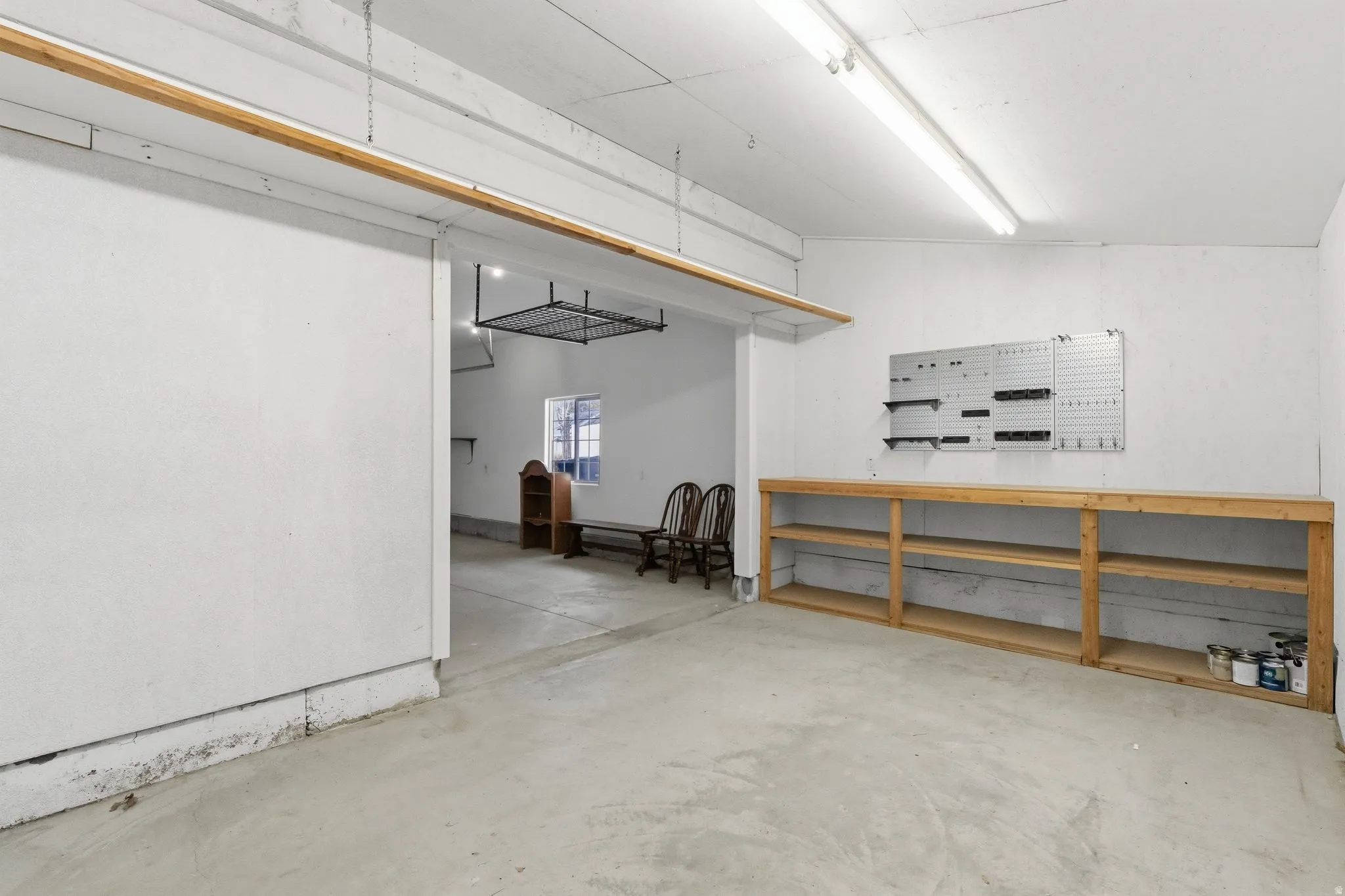 Large workshop located at the back of the 3rd car garage with double door toward back yard.