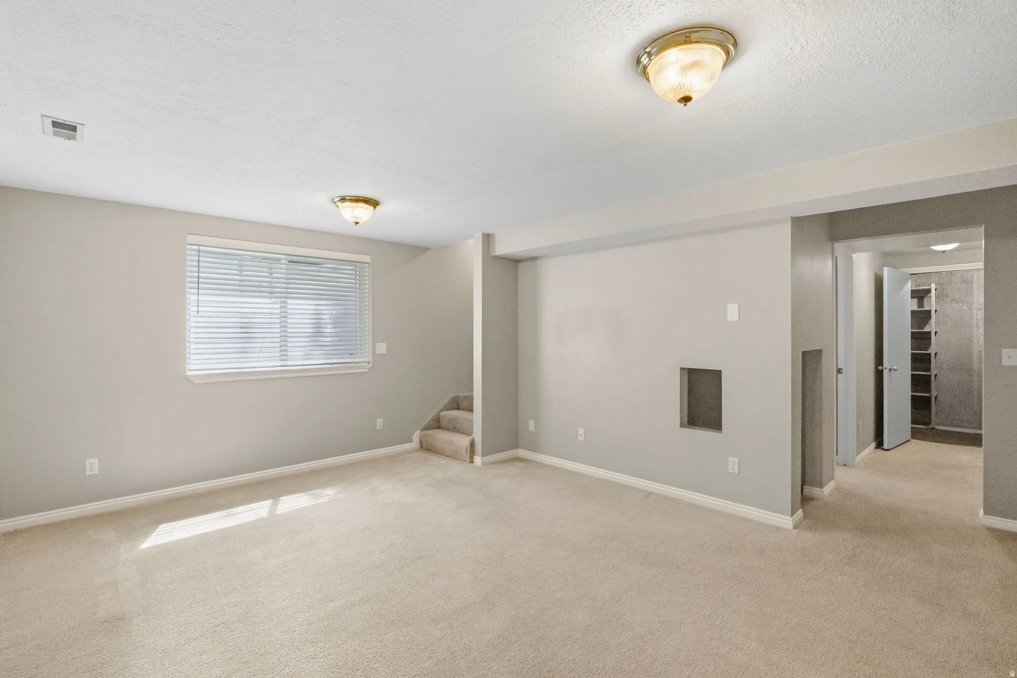 Basement family room view toward the stairs.