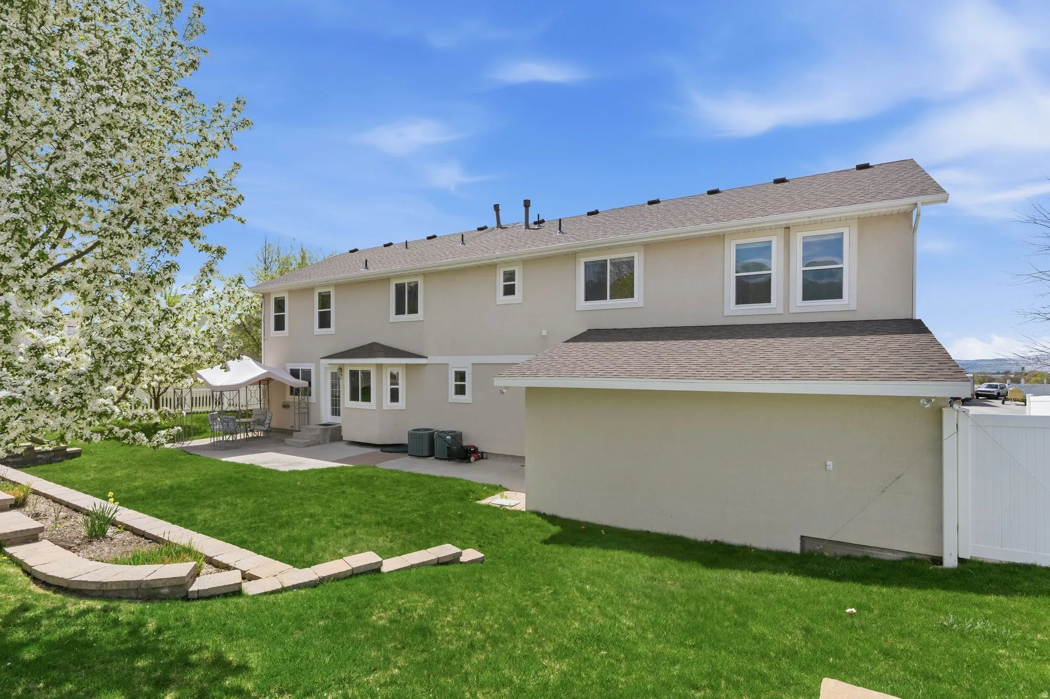 View from garden area toward terraced planters and patio.