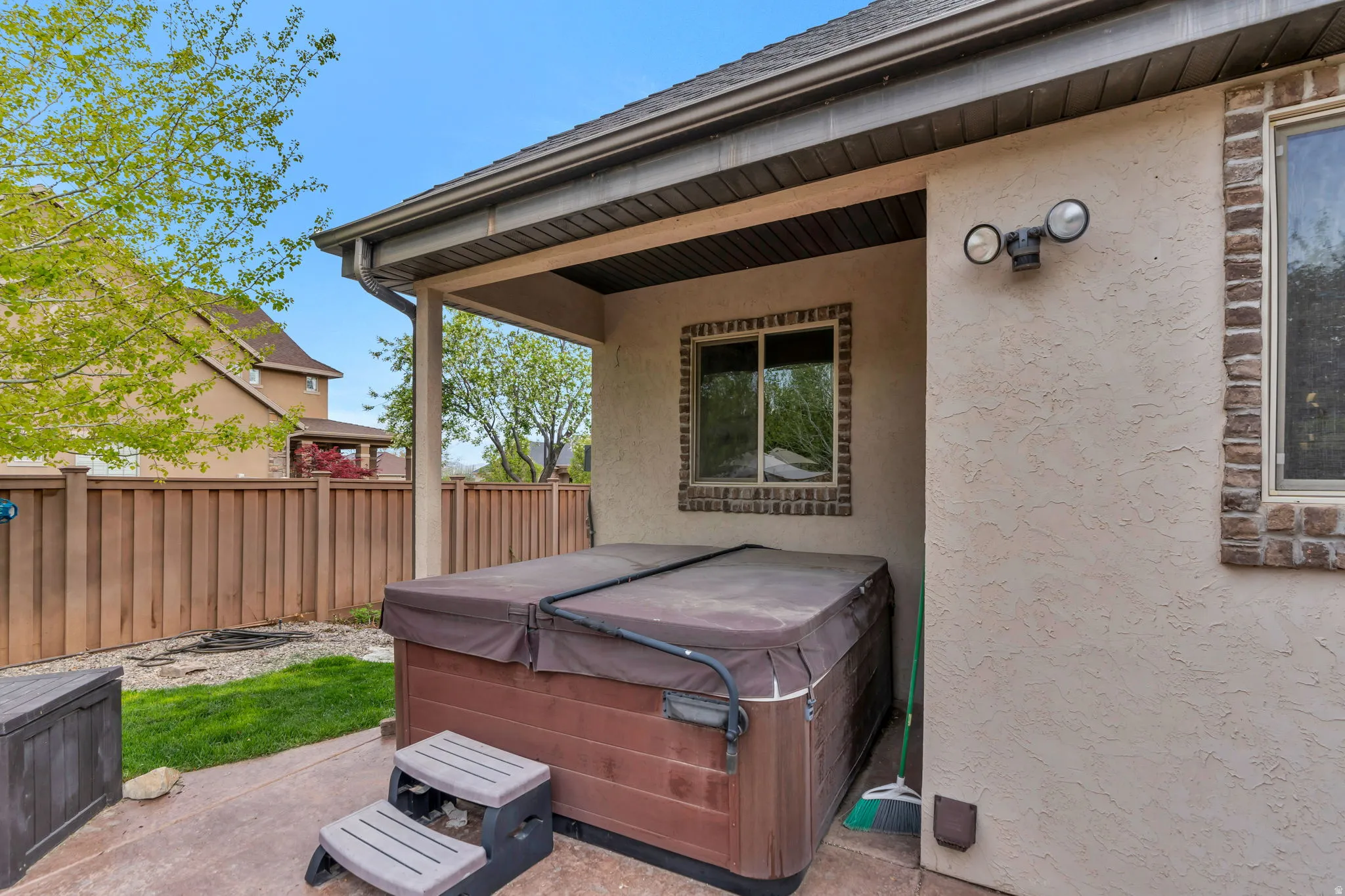 View of patio / terrace with a hot tub