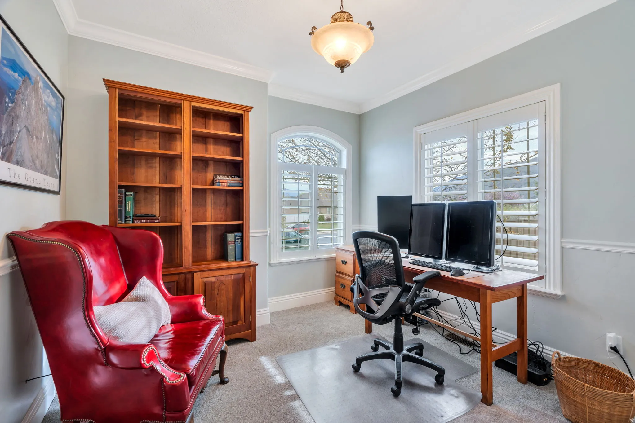 Home office featuring light colored carpet and ornamental molding