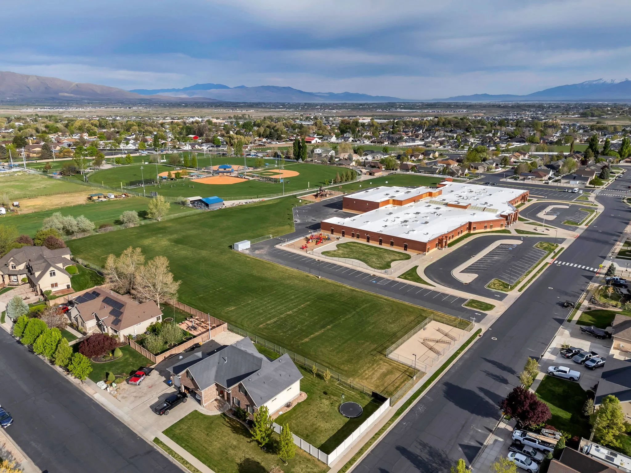 View of property location with a mountain backdrop and nearby suburban area