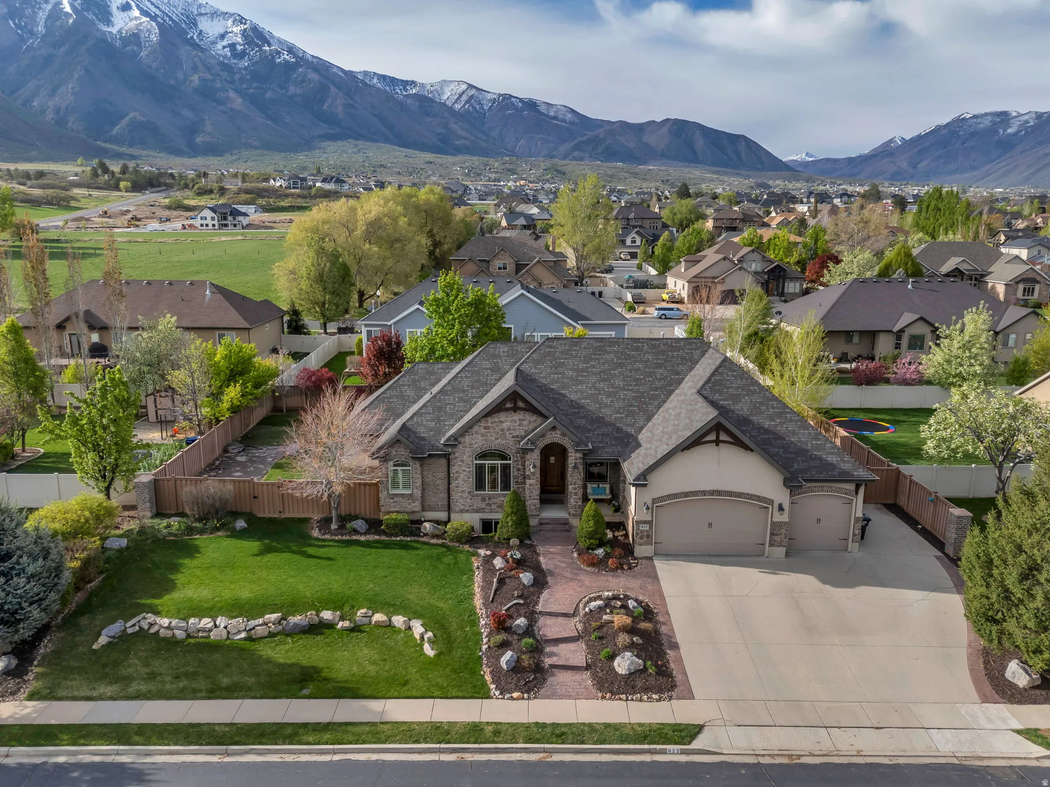 Aerial perspective of suburban area featuring a mountain backdrop