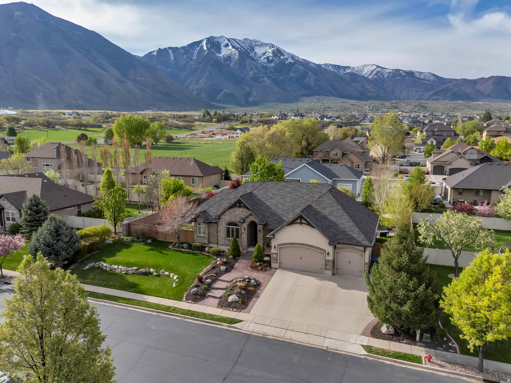 Aerial perspective of suburban area featuring a mountainous background