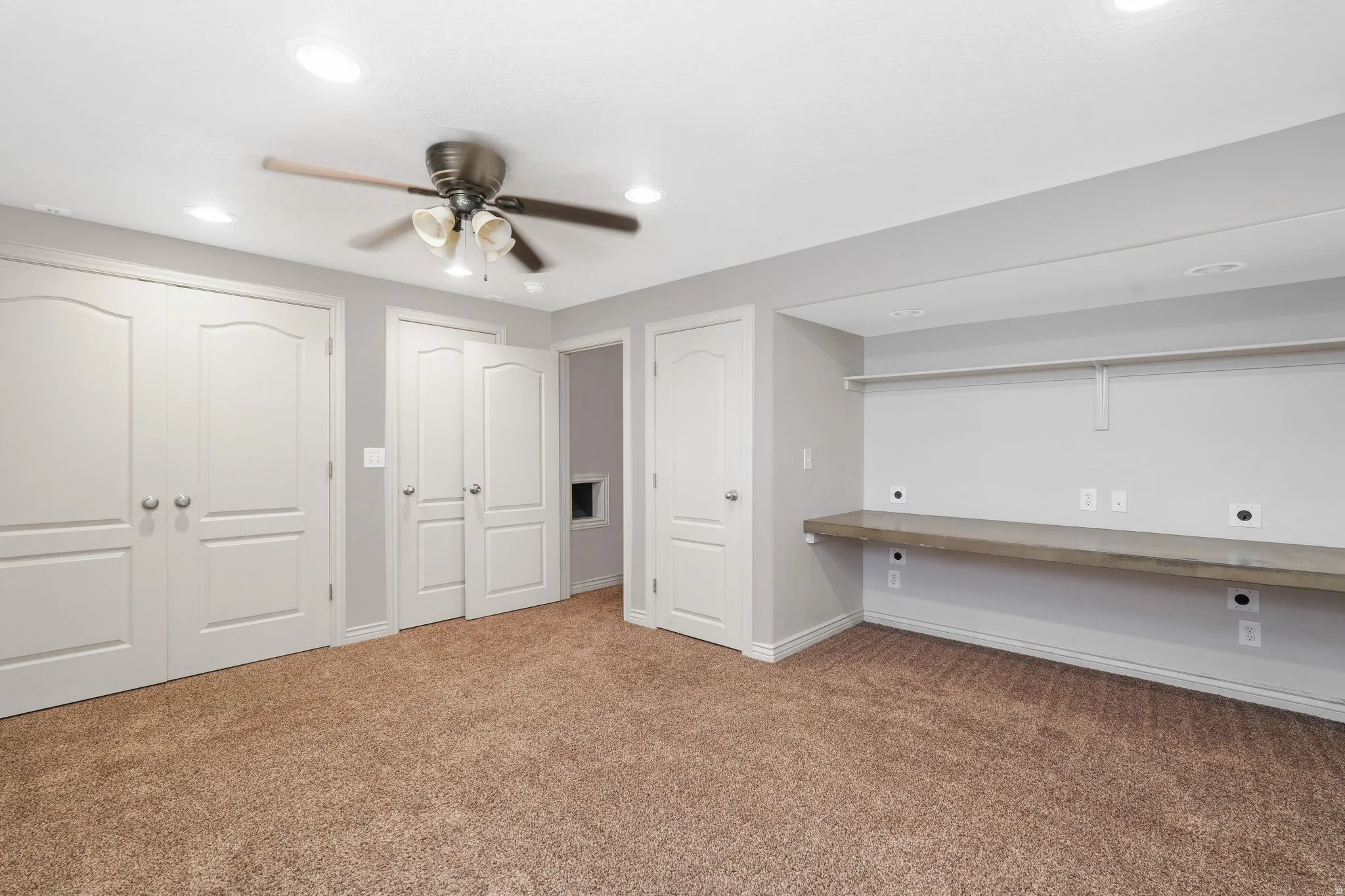 4th Bedroom, Triple closets, built in desk, carpet, a ceiling fan, and recessed lighting