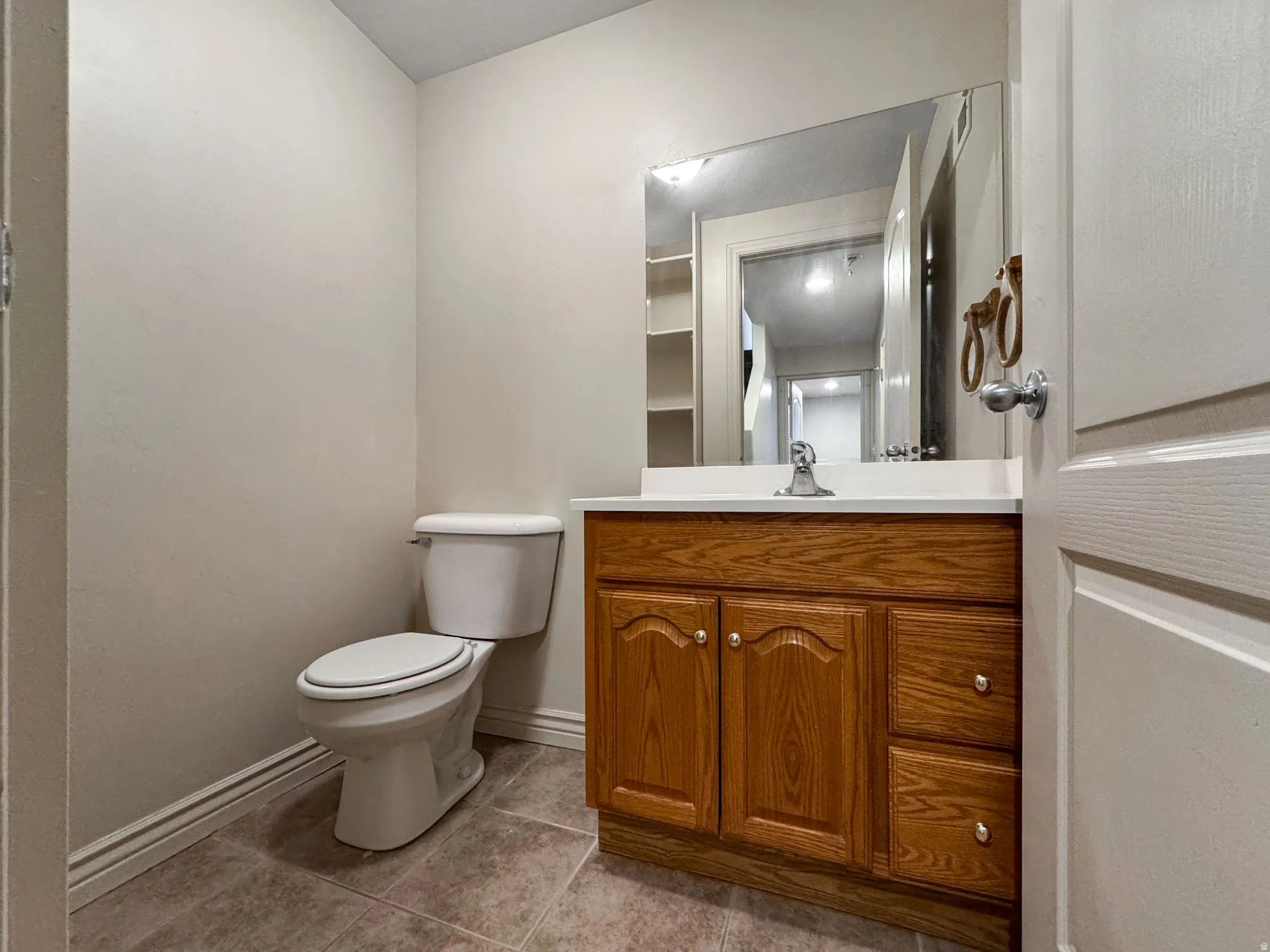 Bathroom featuring vanity and light tile patterned floors