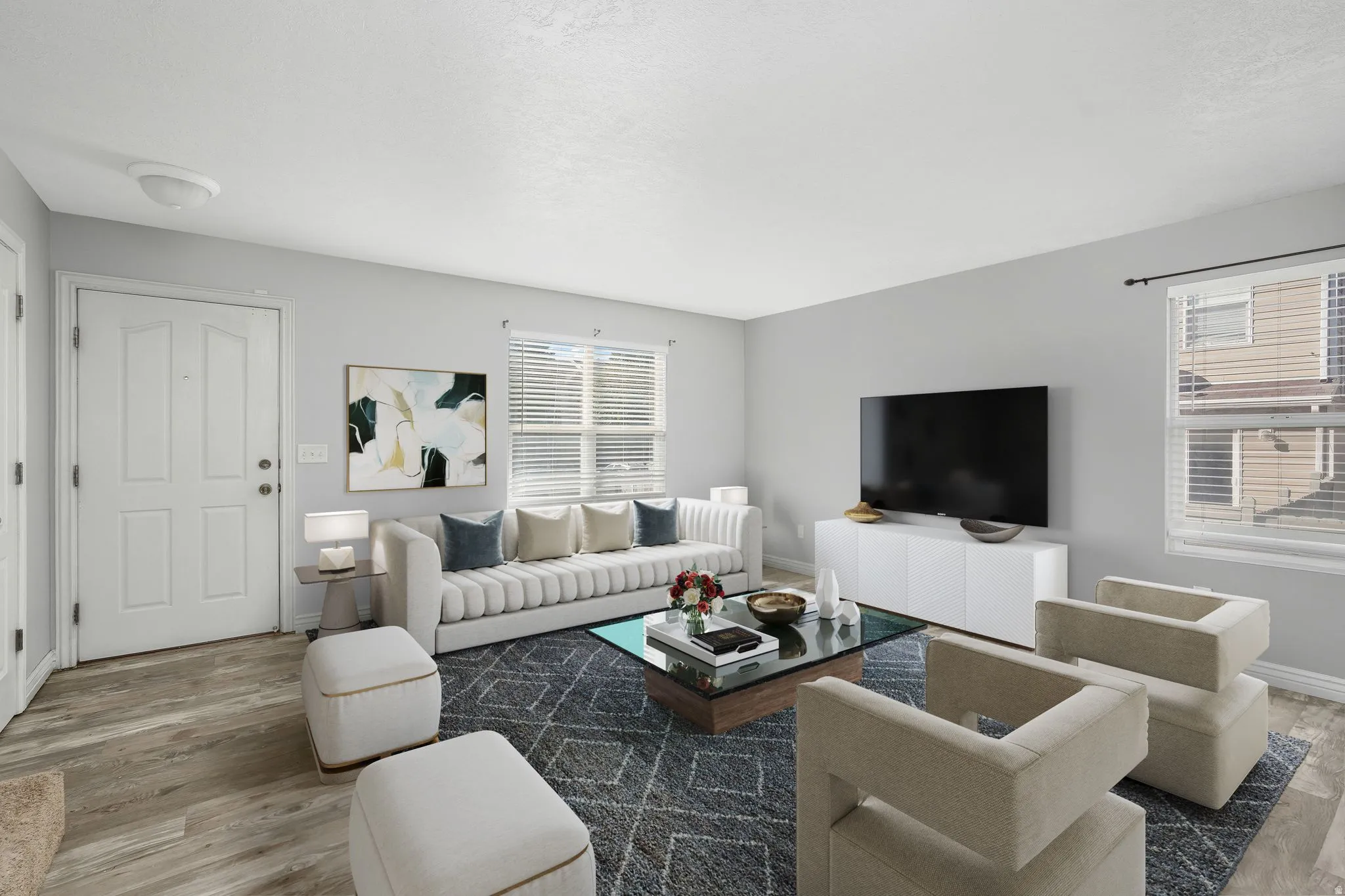 Living room featuring wood finished floors and healthy amount of natural light