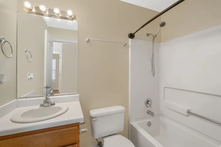 Full bathroom with vanity and bathing tub / shower combination