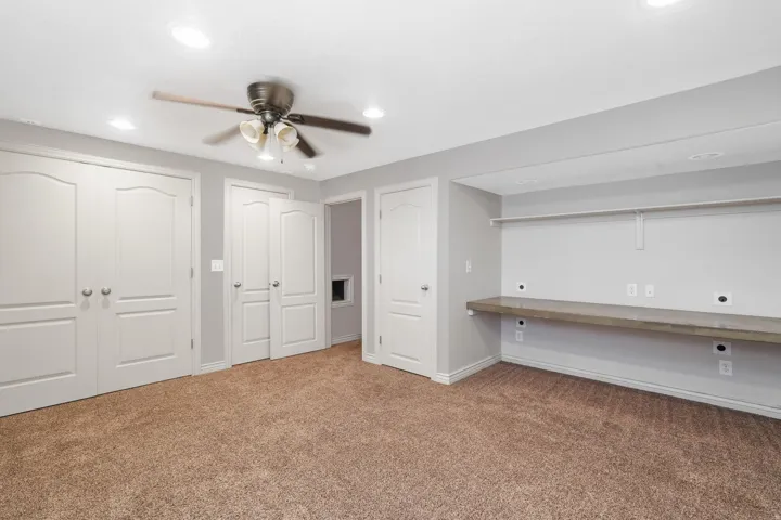 4th Bedroom, Triple closets, built in desk, carpet, a ceiling fan, and recessed lighting