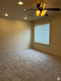 Room featuring wall-to-wall carpeting, recessed ceiling lighting, and a ceiling fan with integrated illumination