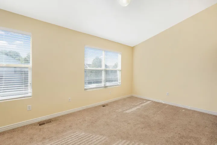 Unfurnished room featuring carpet flooring and baseboards
