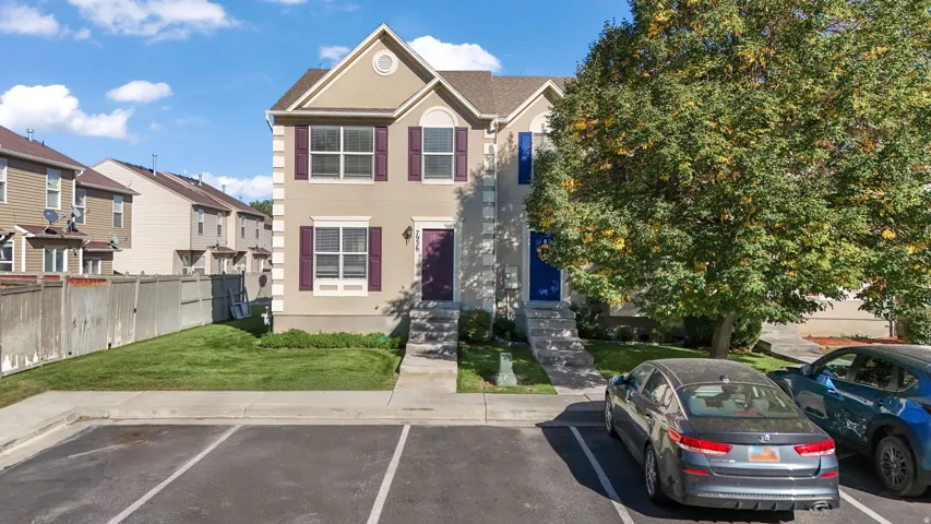View of front facade featuring stucco siding, 2 Front parking spots!
