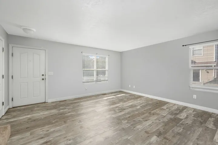 Entrance foyer with wood finished floors and healthy amount of natural light
