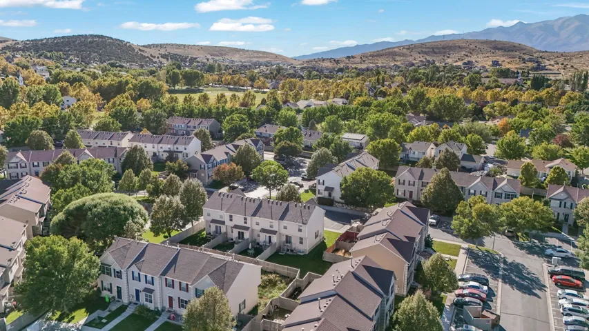 Aerial view of residential area featuring a mountain backdrop