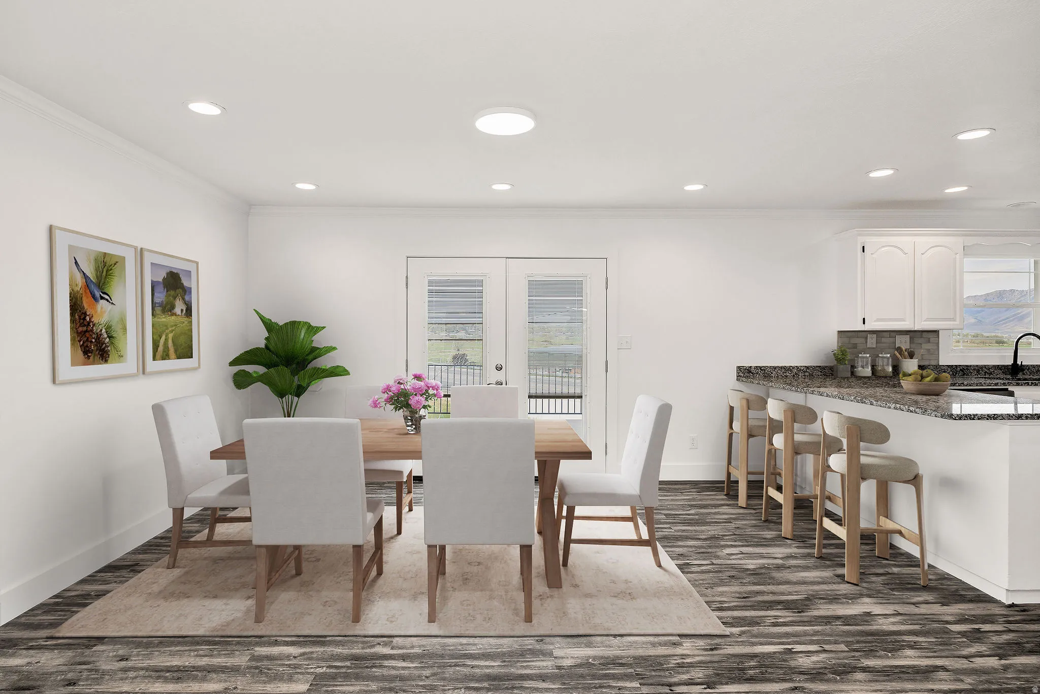 Virtually staged. Open-concept dining area featuring wood-finish flooring, recessed lighting, and white trim