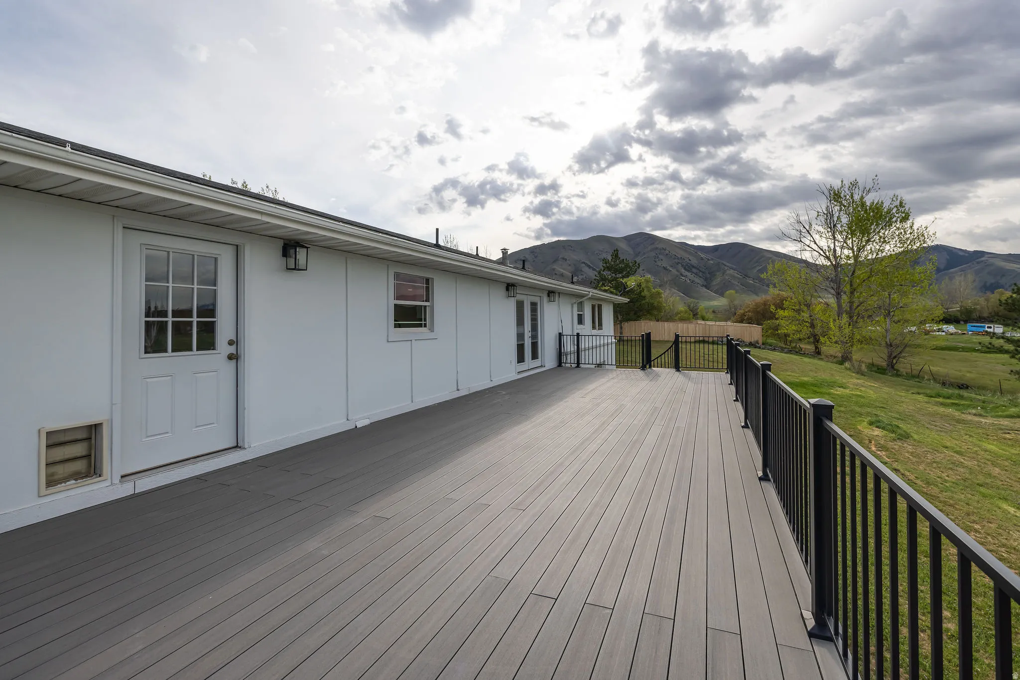 Deck featuring a yard and a mountain view