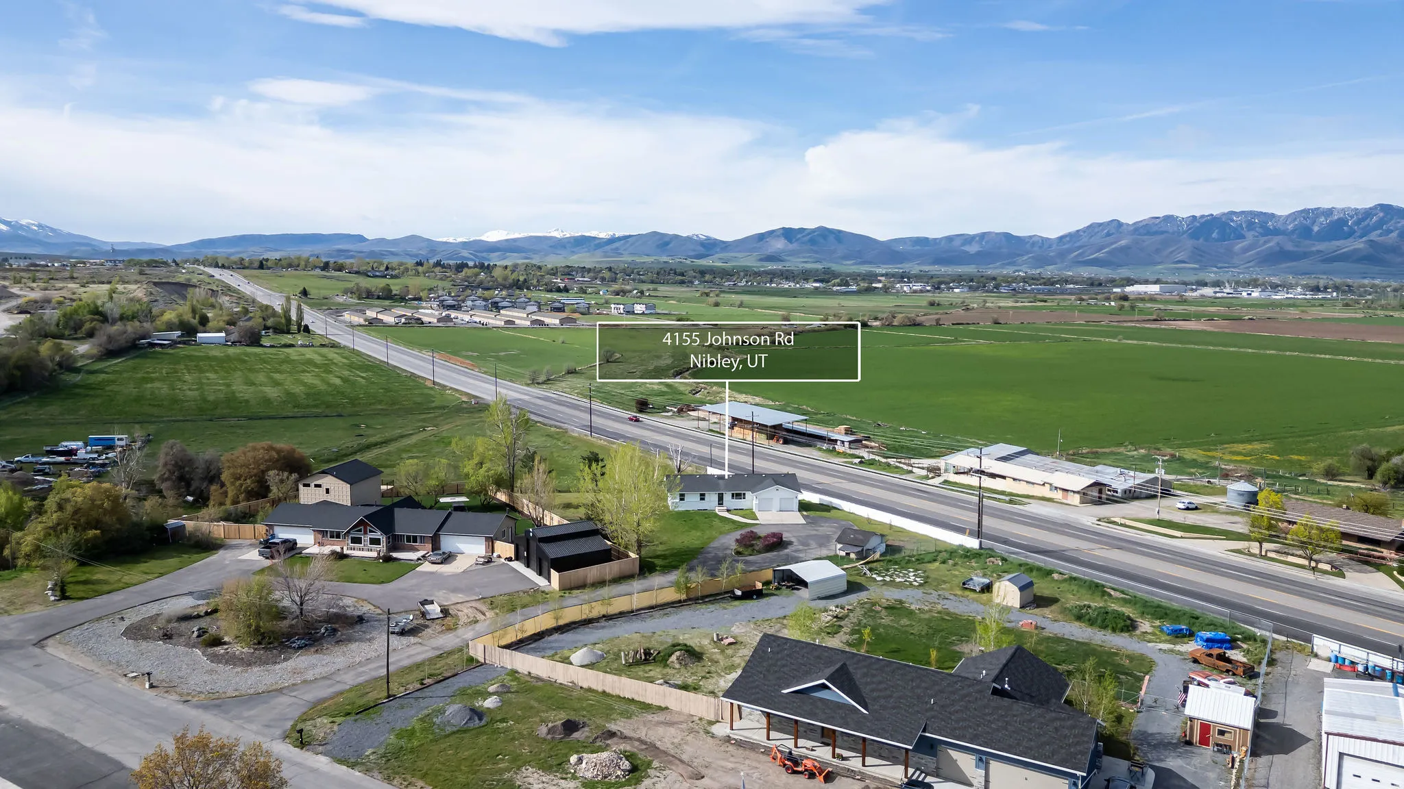 Aerial view of sparsely populated area featuring mountains and nearby suburban area