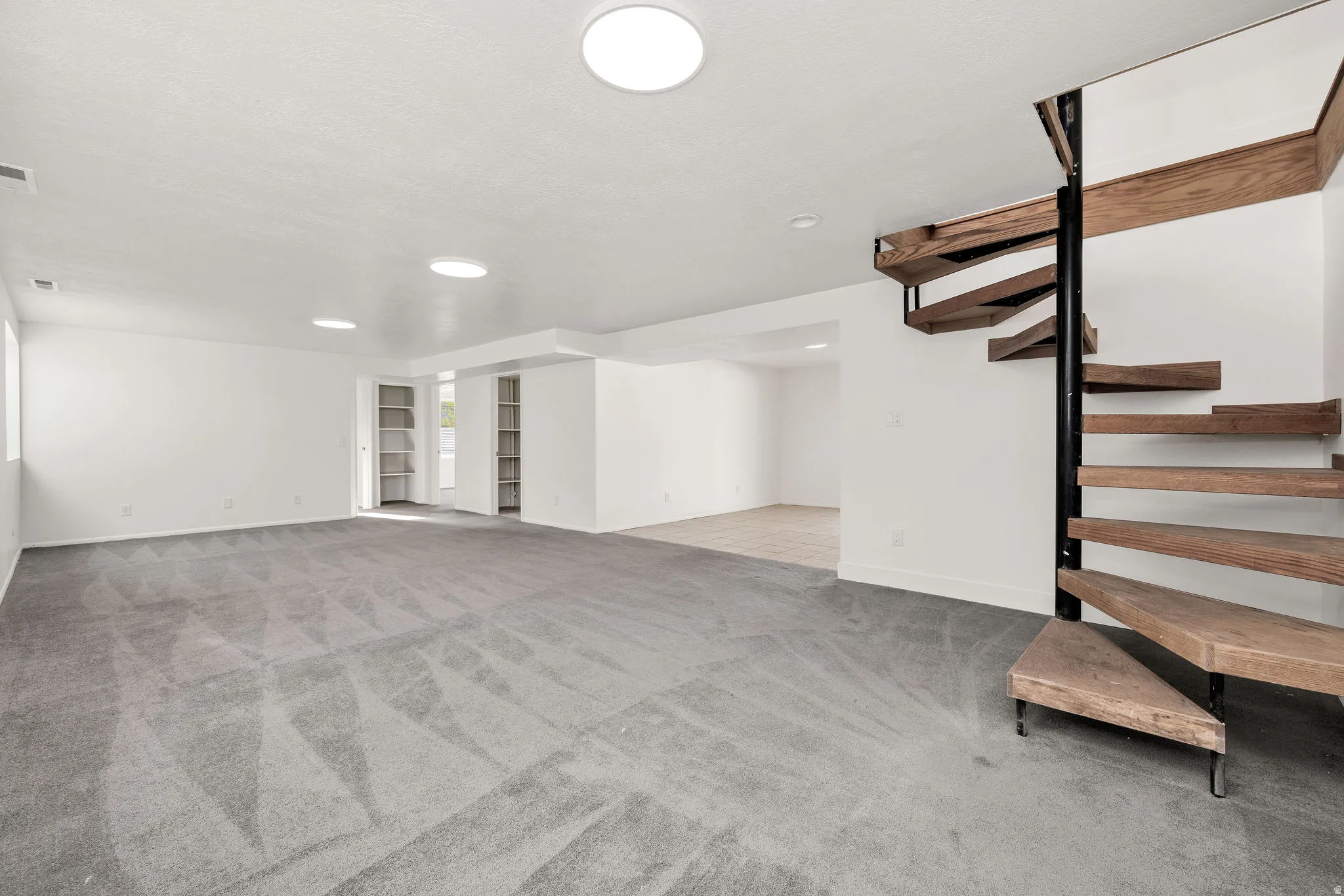 Finished below grade area with light carpet and built in features