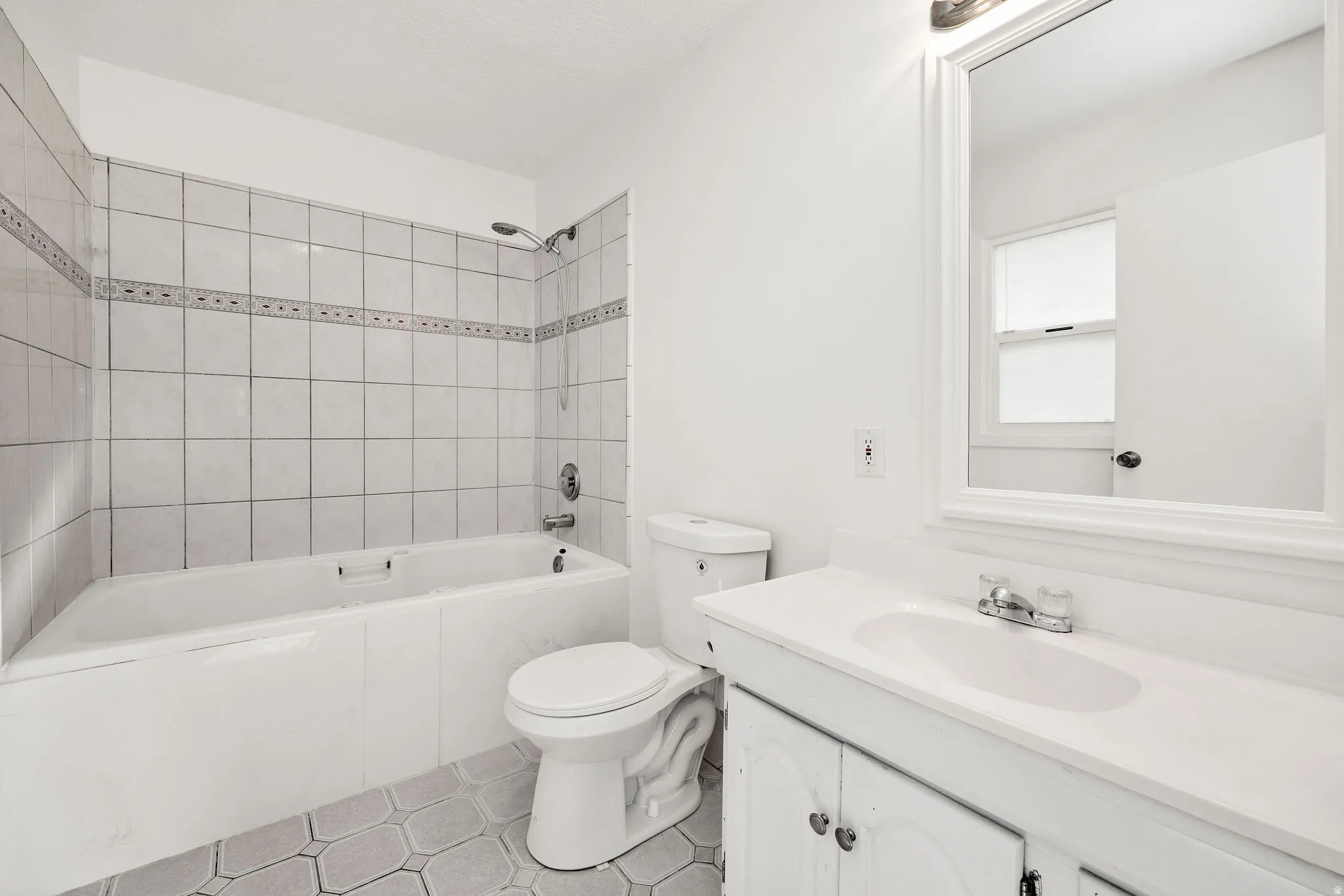 Full bathroom featuring vanity and  shower combination