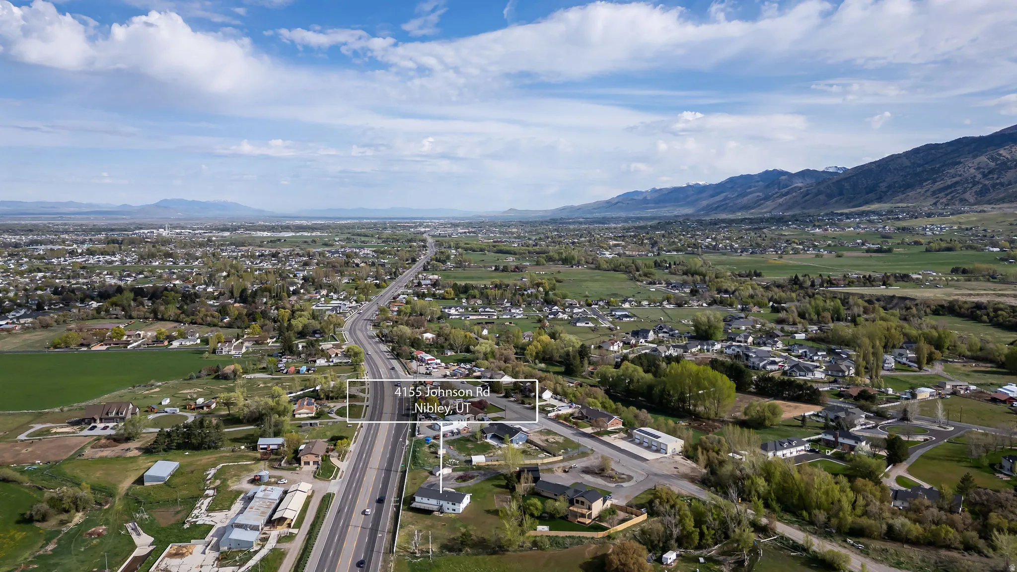 Aerial perspective of suburban area with a mountainous background