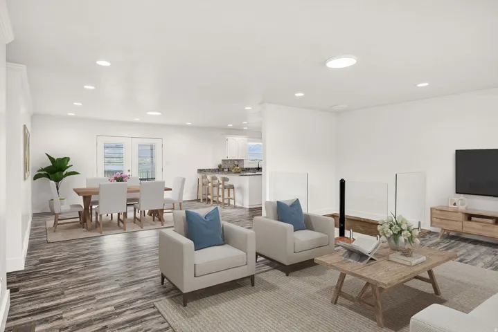 Virtually staged. Spacious interior with wood-finish flooring and recessed lighting