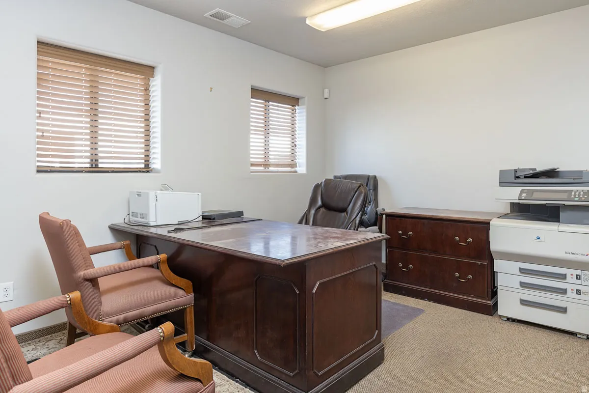 Office area with light colored carpet