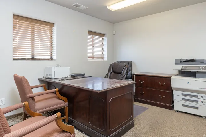 Office area with light colored carpet