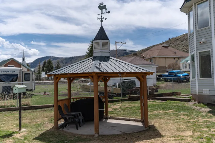 View of yard with a gazebo, a patio, and a mountain view
