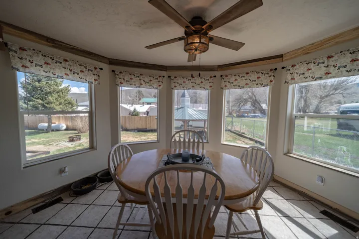 Sunroom / solarium with tile patterned flooring