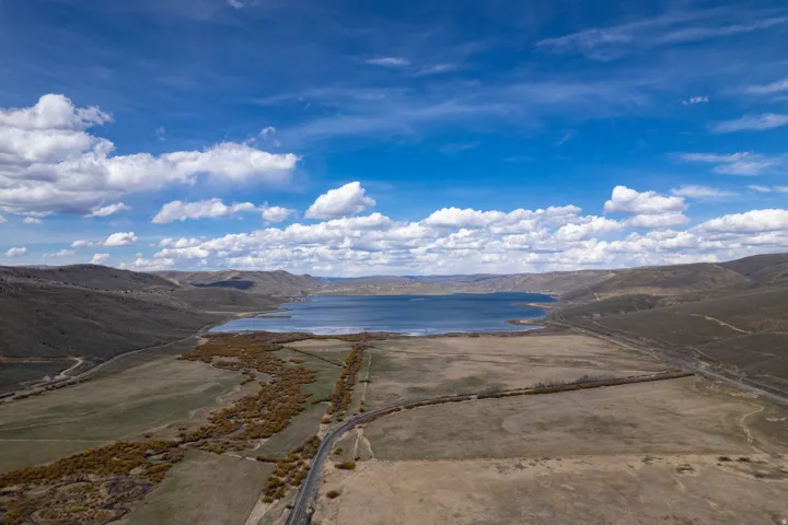 View of South side of Scofield Reservoir, featuring a mountainous background