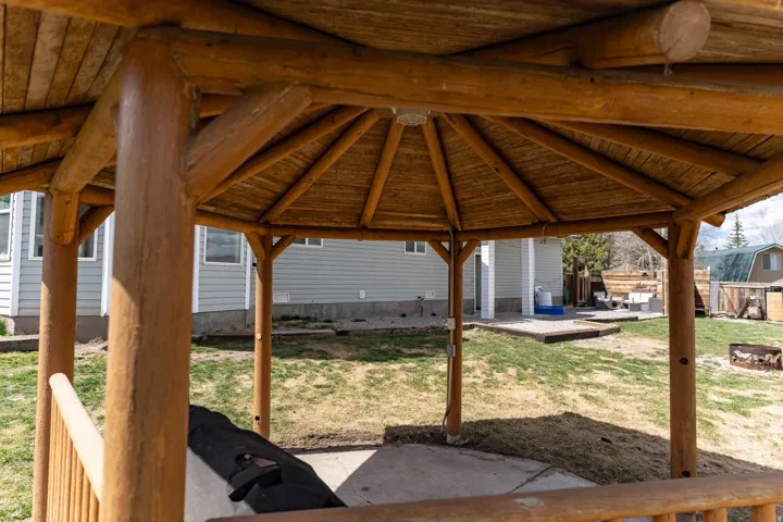 View of patio / terrace with an outdoor fire pit and a gazebo
