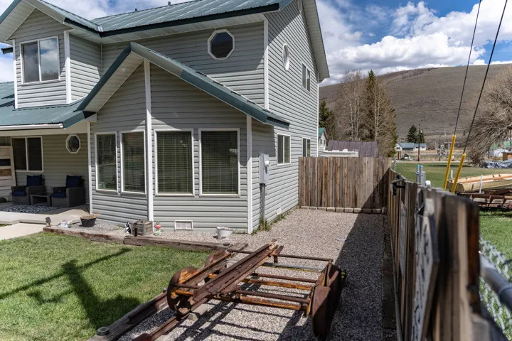 View of front of home featuring a metal roof and a patio area