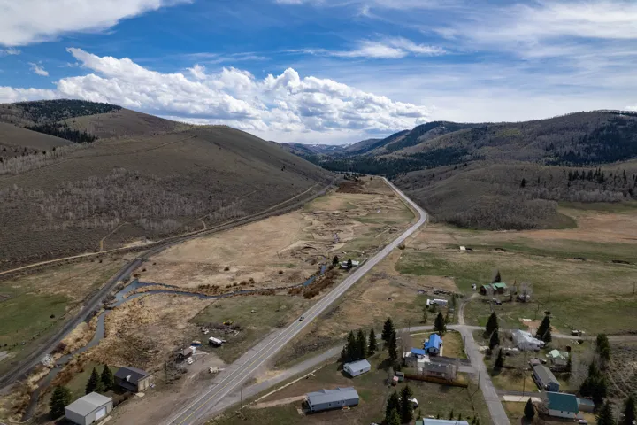 Overview of rural landscape featuring a mountainous background