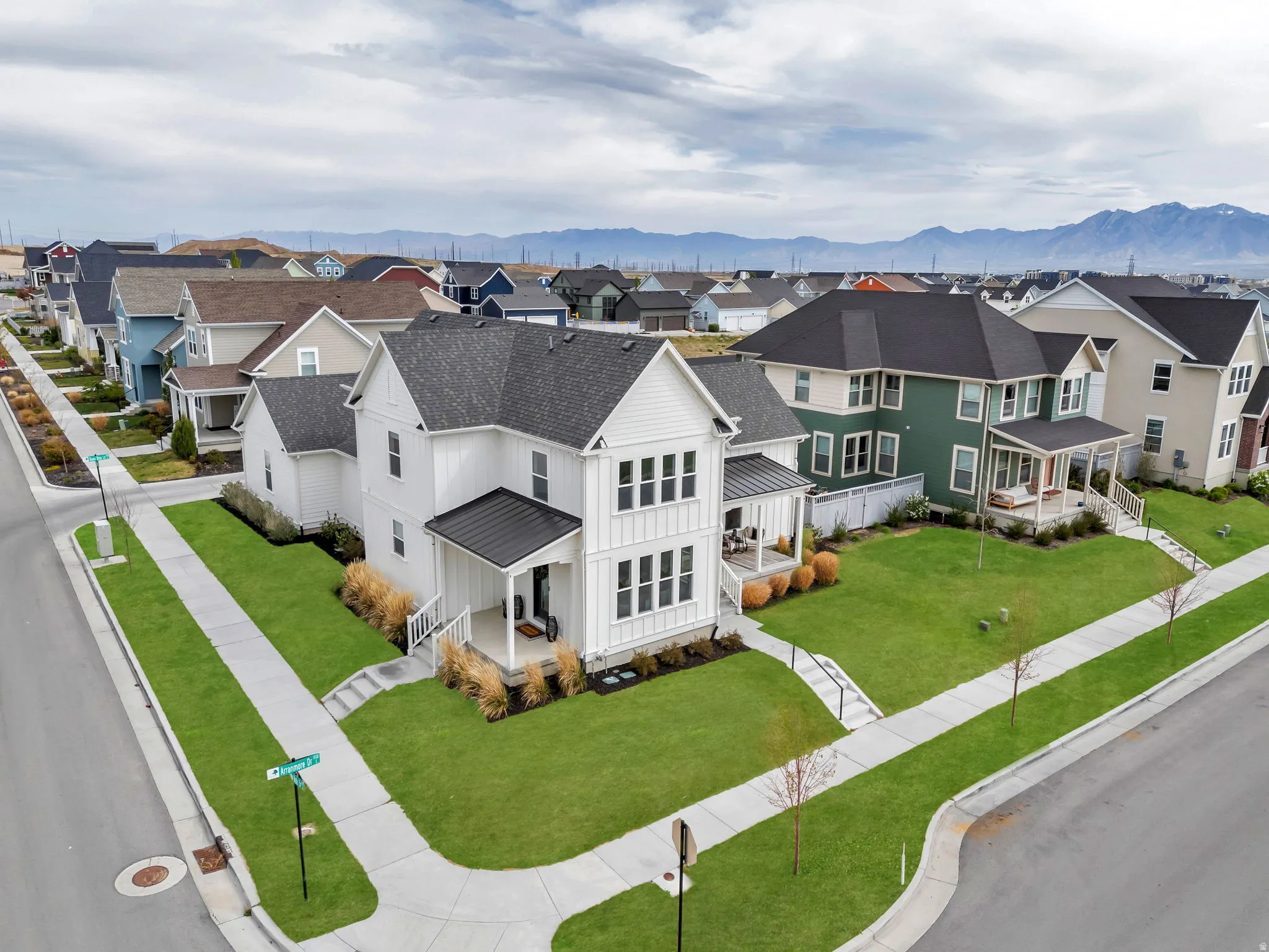 Aerial view of residential area featuring a mountain backdrop