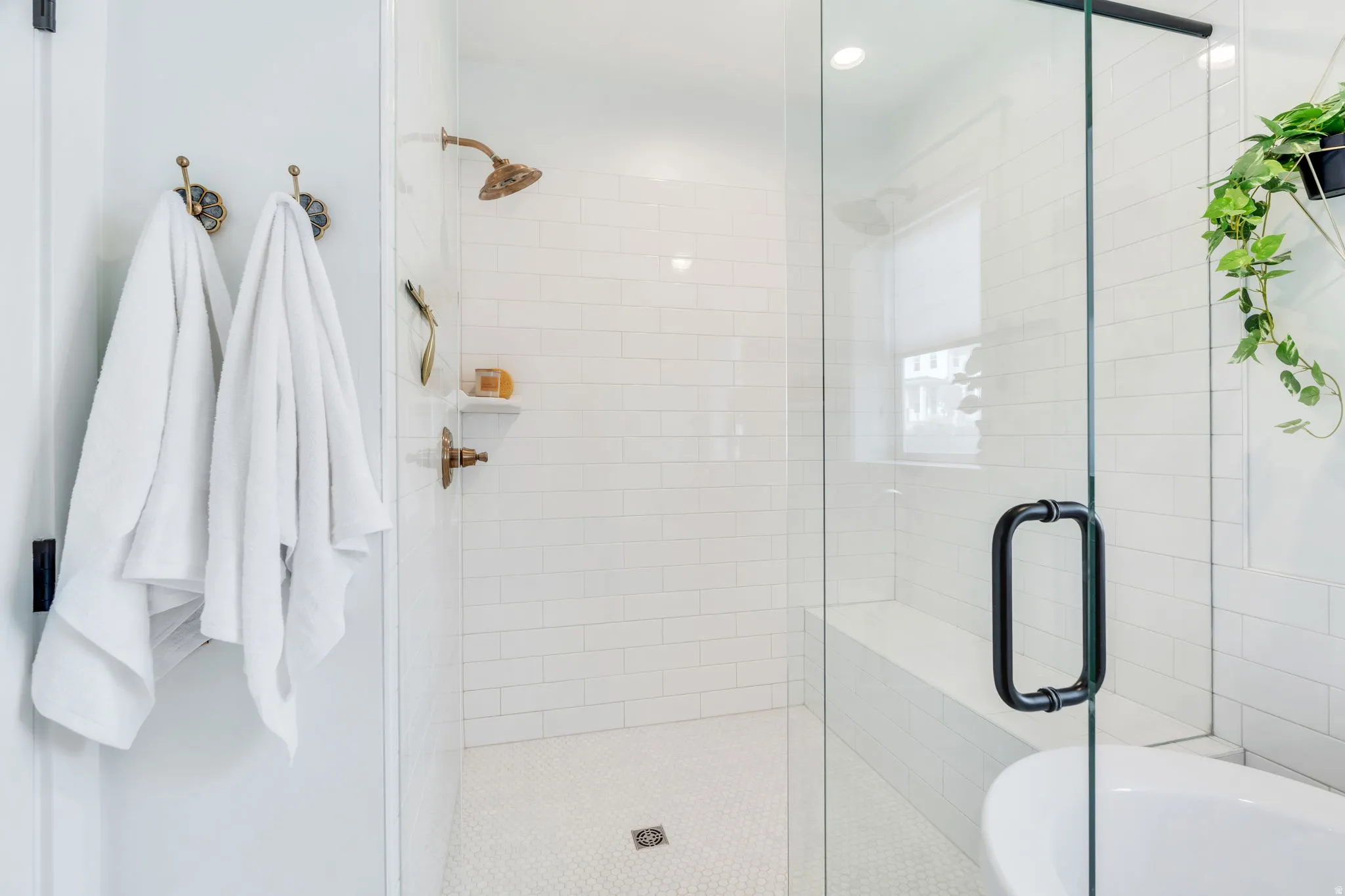 Full bathroom with a stall shower and a tub