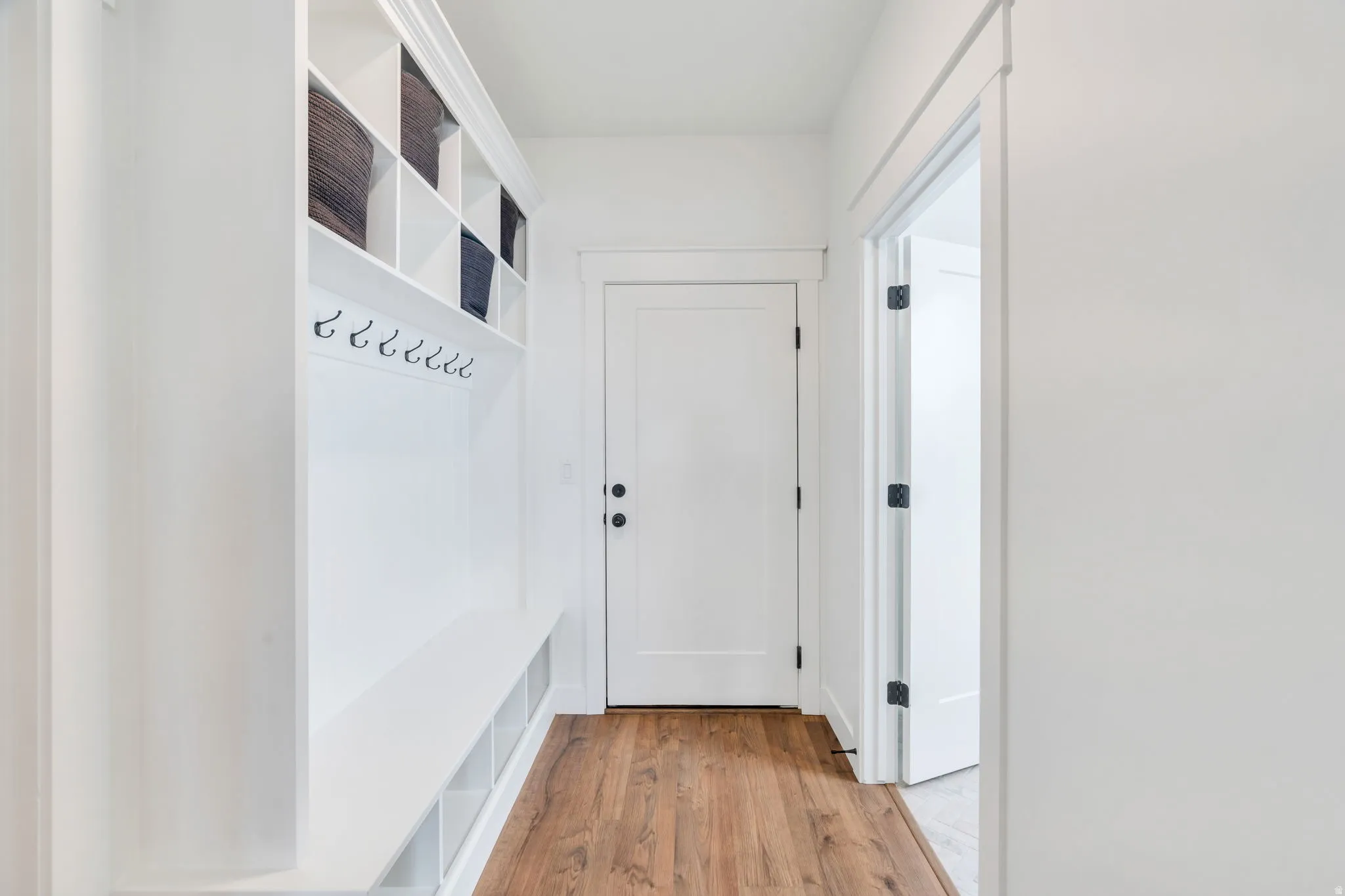 Mudroom featuring light wood finished floors