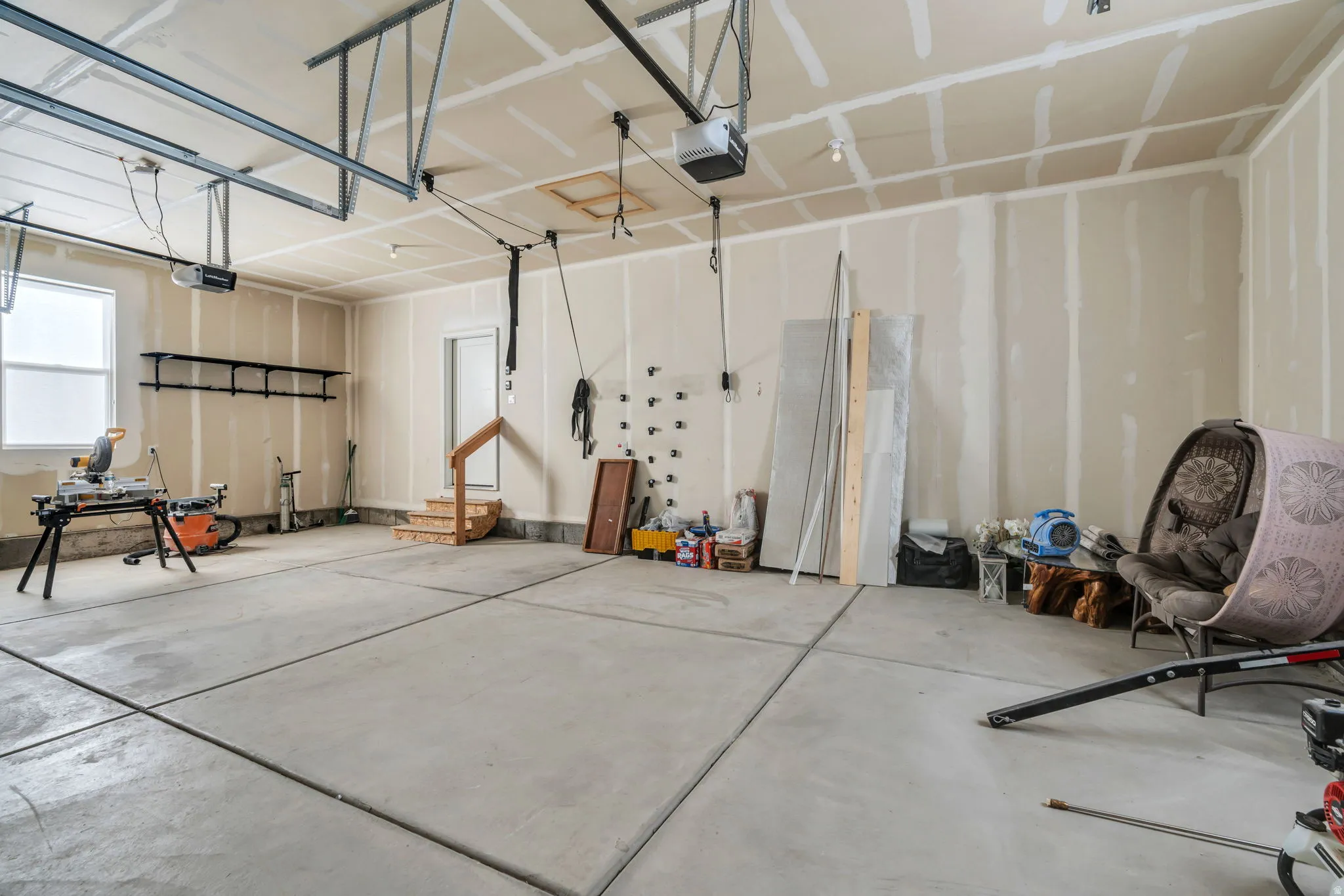 Garage featuring a garage door opener