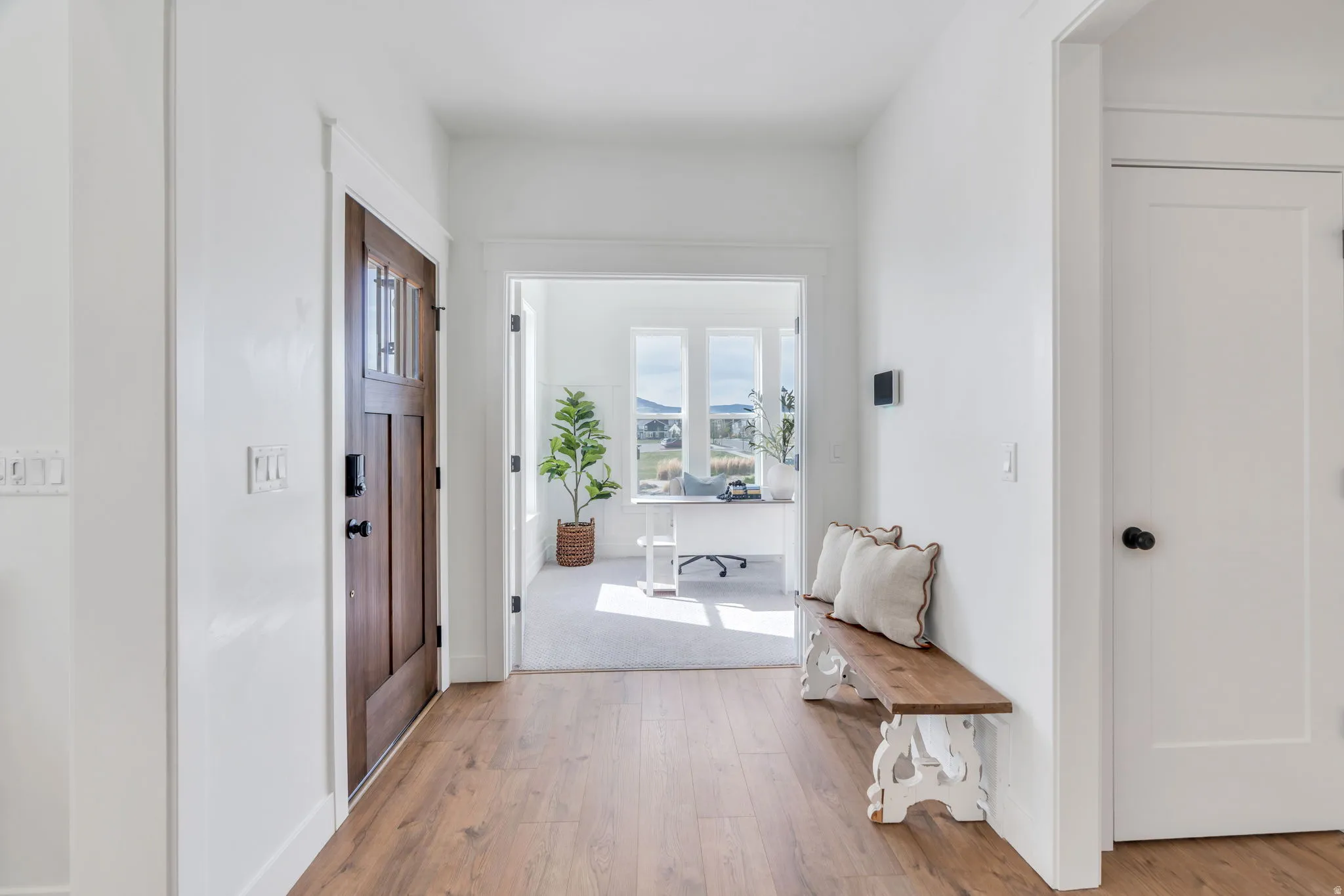 Hallway featuring light wood-style floors and a mountain view