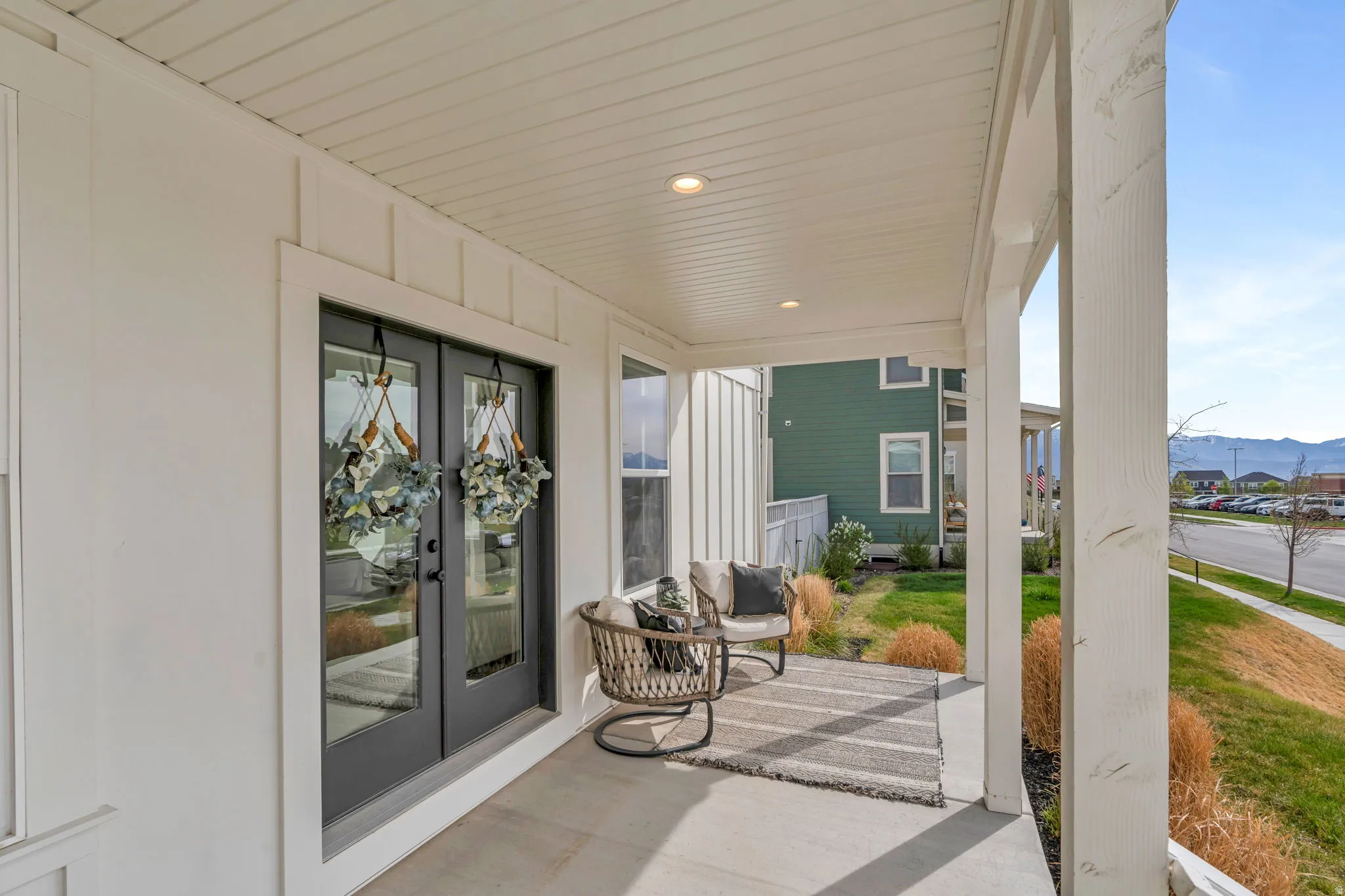 Porch with french doors and a mountain view