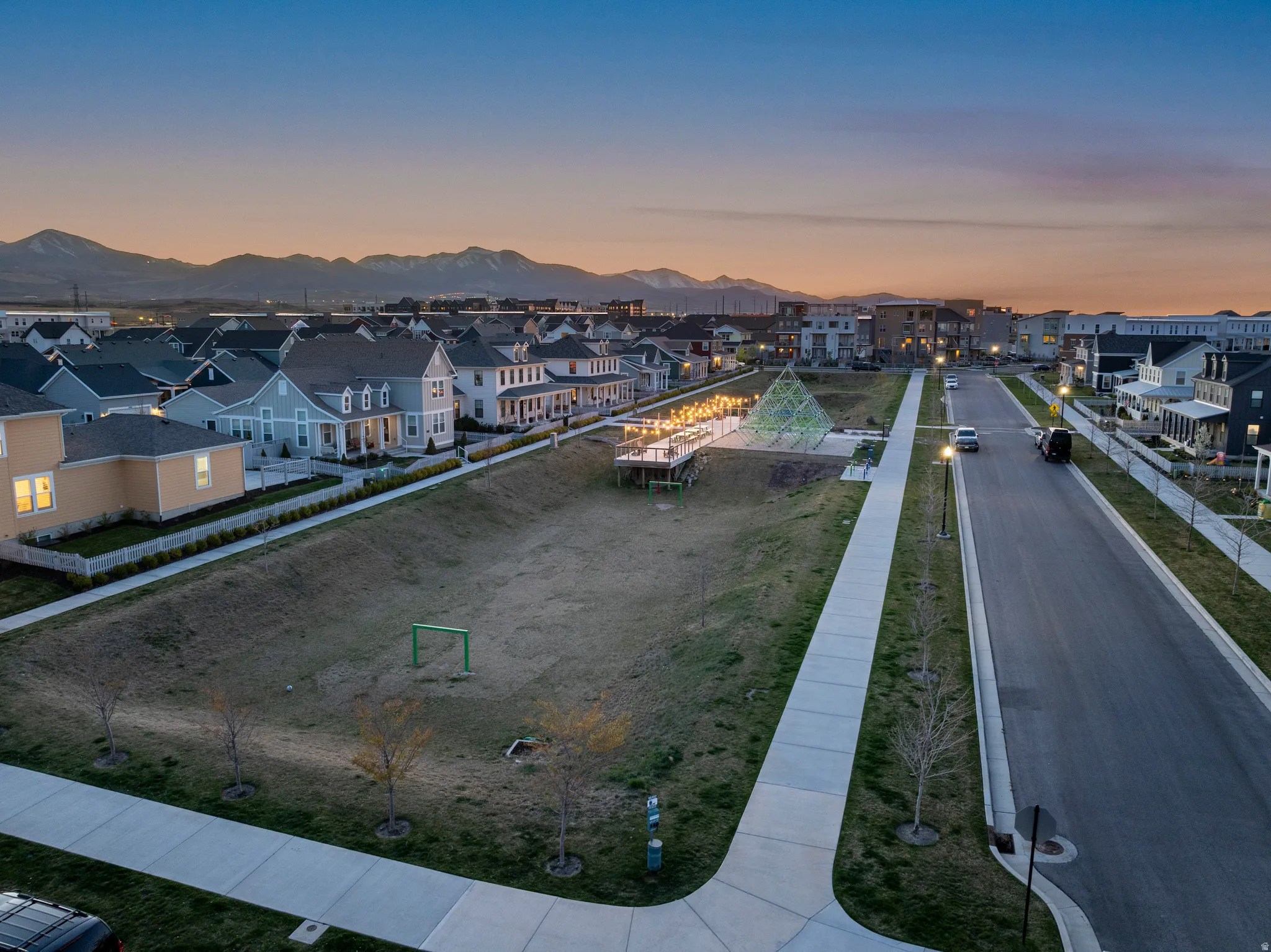 Aerial view at dusk of a residential view and a mountain view