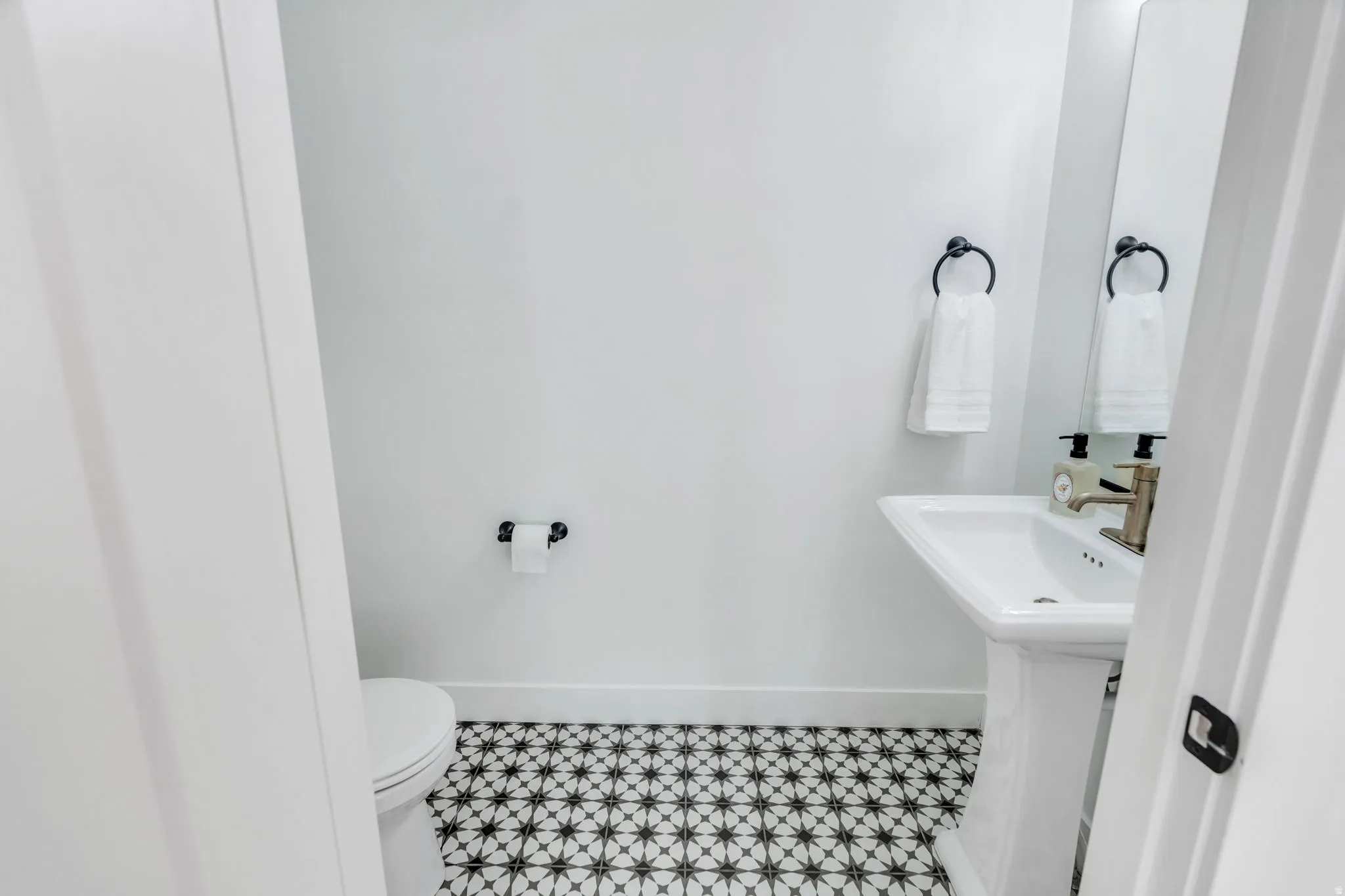 Bathroom featuring toilet and baseboards
