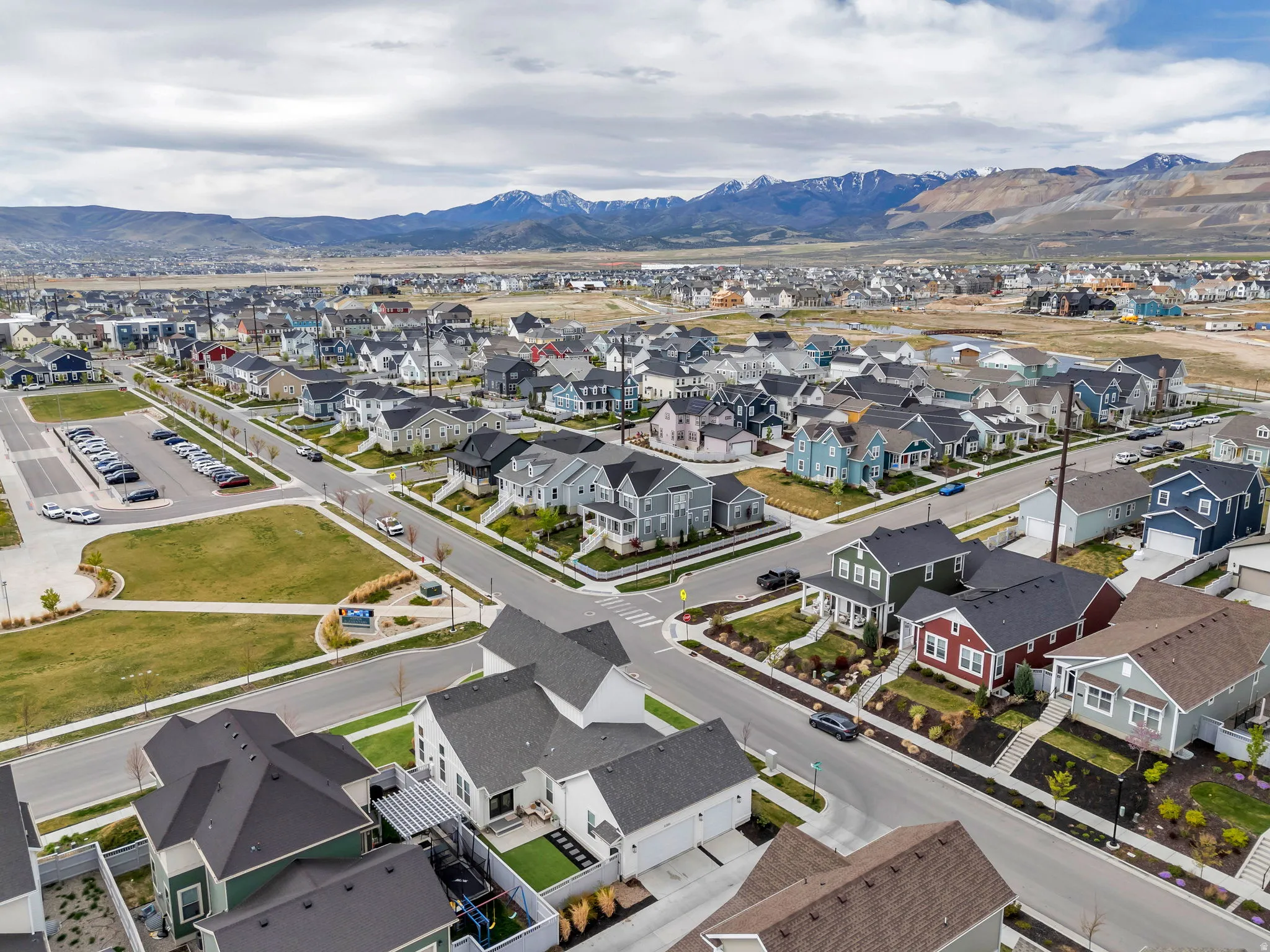 Aerial perspective of suburban area with a mountainous background