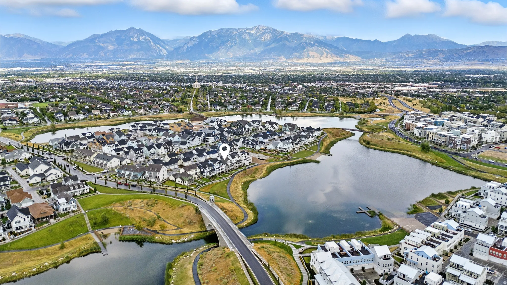 Aerial view of residential area featuring a water and mountain view