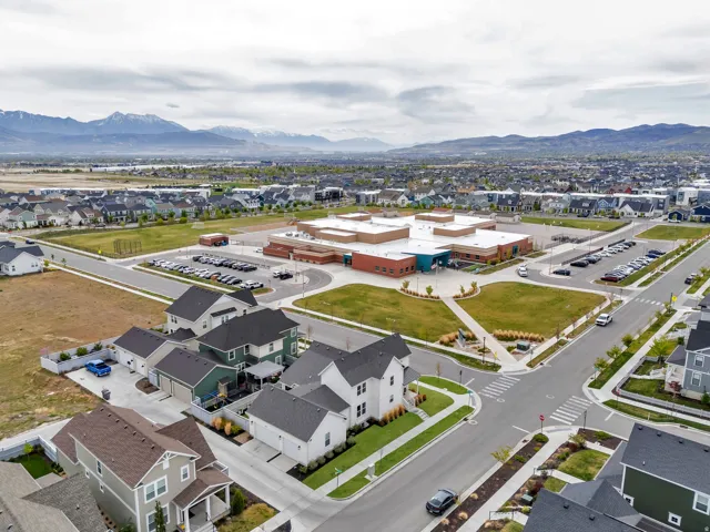Aerial perspective of suburban area featuring a mountain backdrop