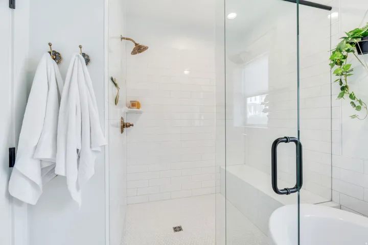 Full bathroom with a stall shower and a tub
