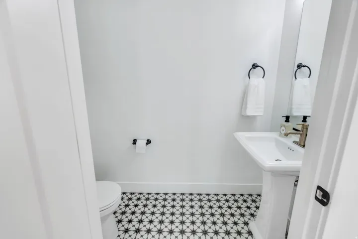 Bathroom featuring toilet and baseboards