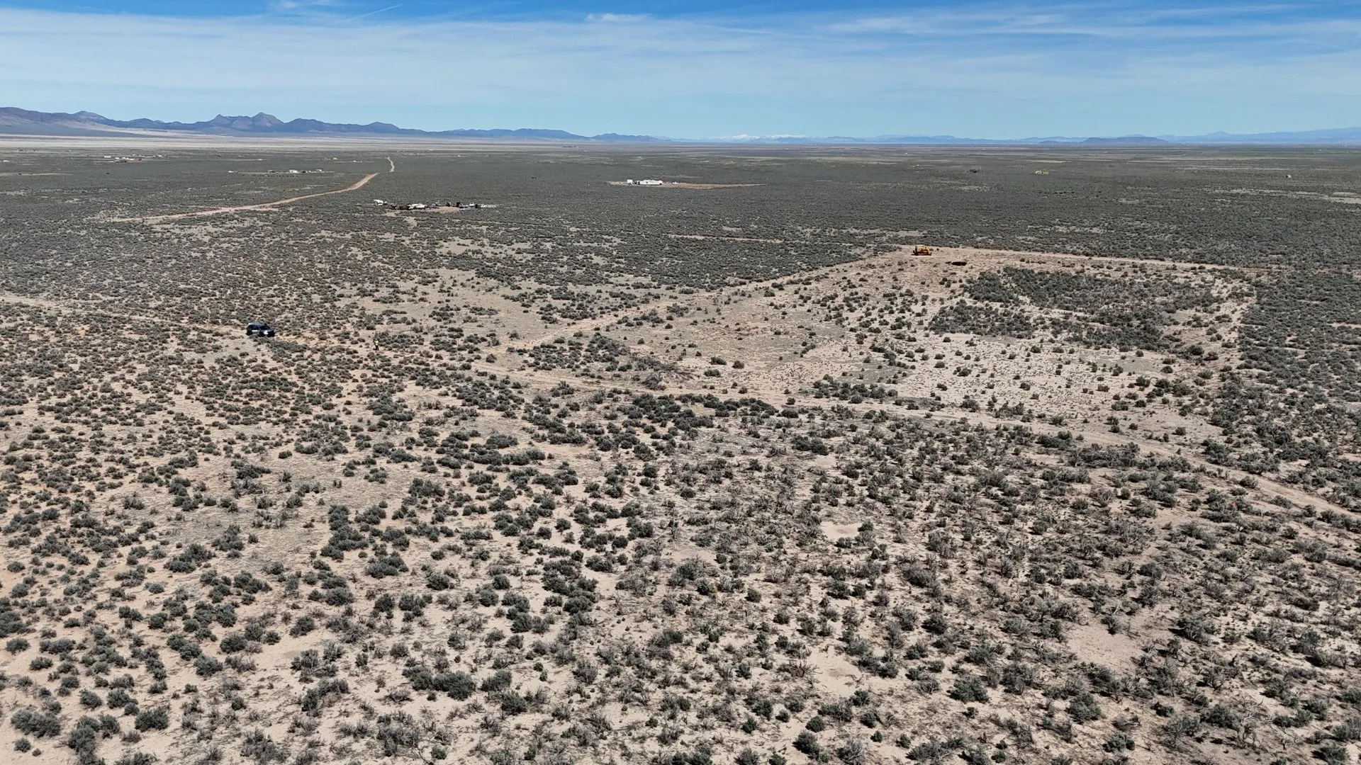 View of rural area featuring a mountainous background and a desert landscape