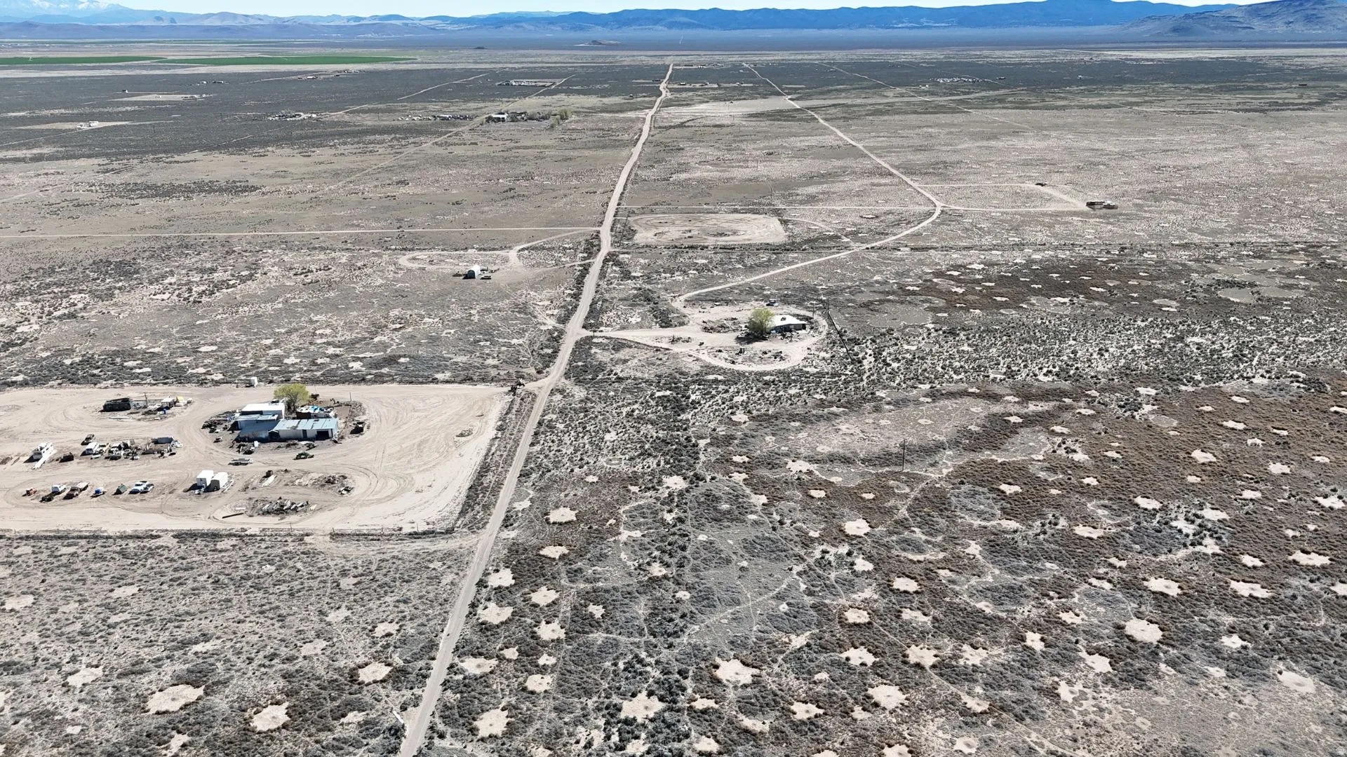 Aerial view of property's location featuring mountains and rural landscape