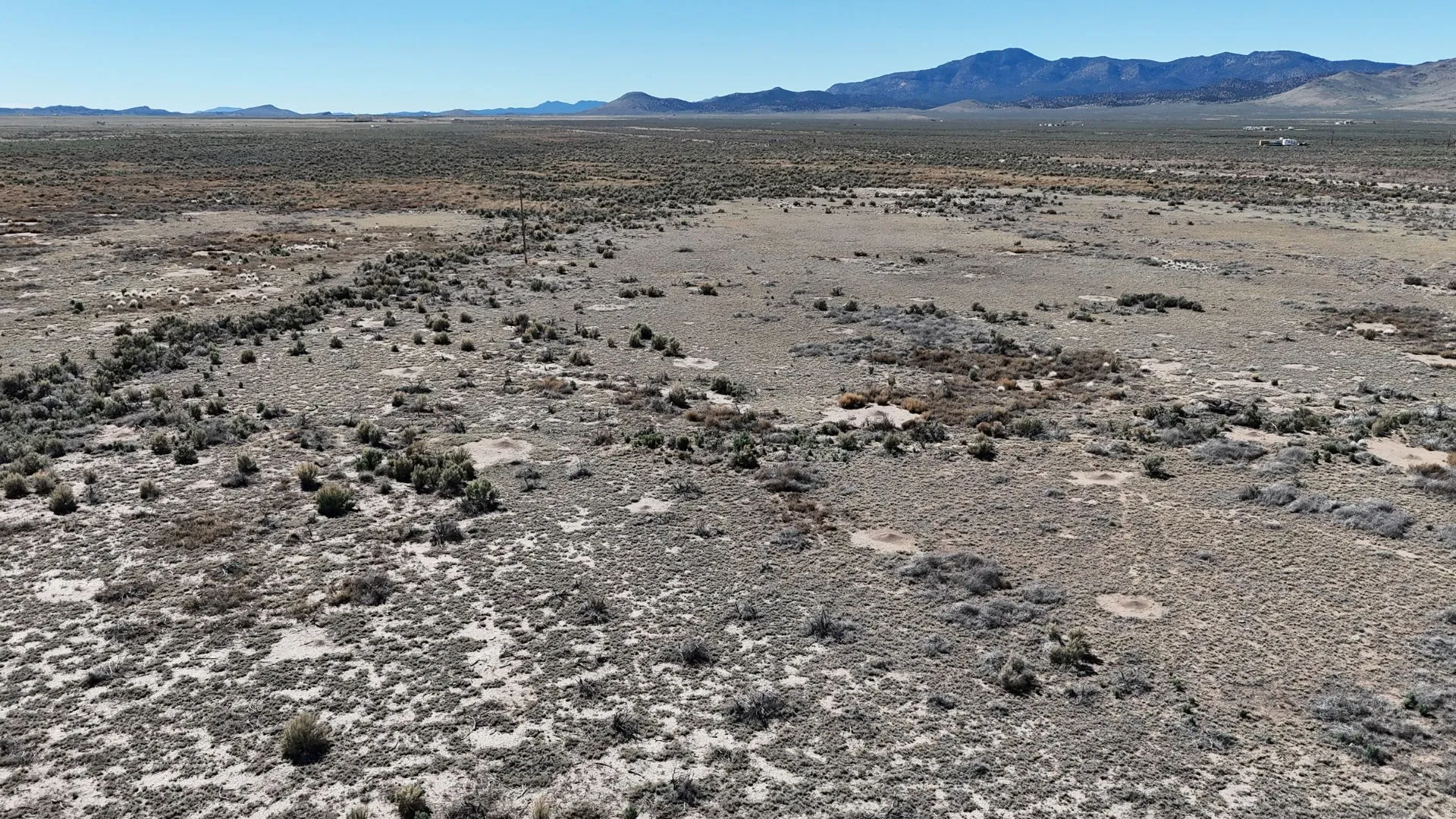 View of mountain backdrop featuring a desert landscape and rural landscape
