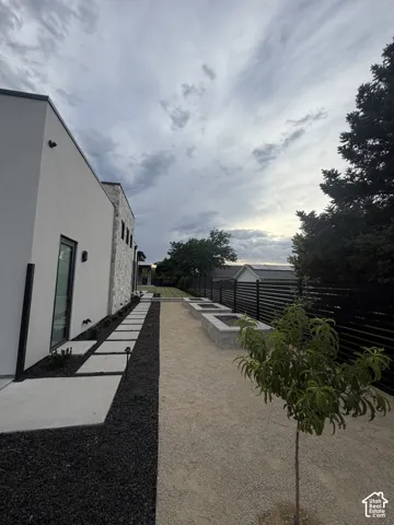 Modern exterior featuring white stucco and stone accents